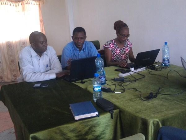 Tharaka translation team doing consultant checking with Okumu